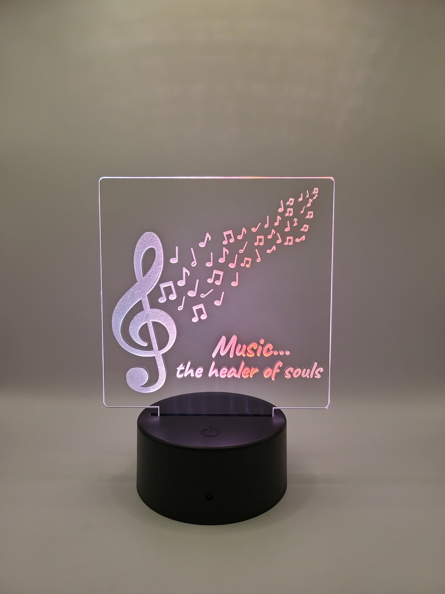 Music, healer of souls acrylic sign, with color-changing light base.