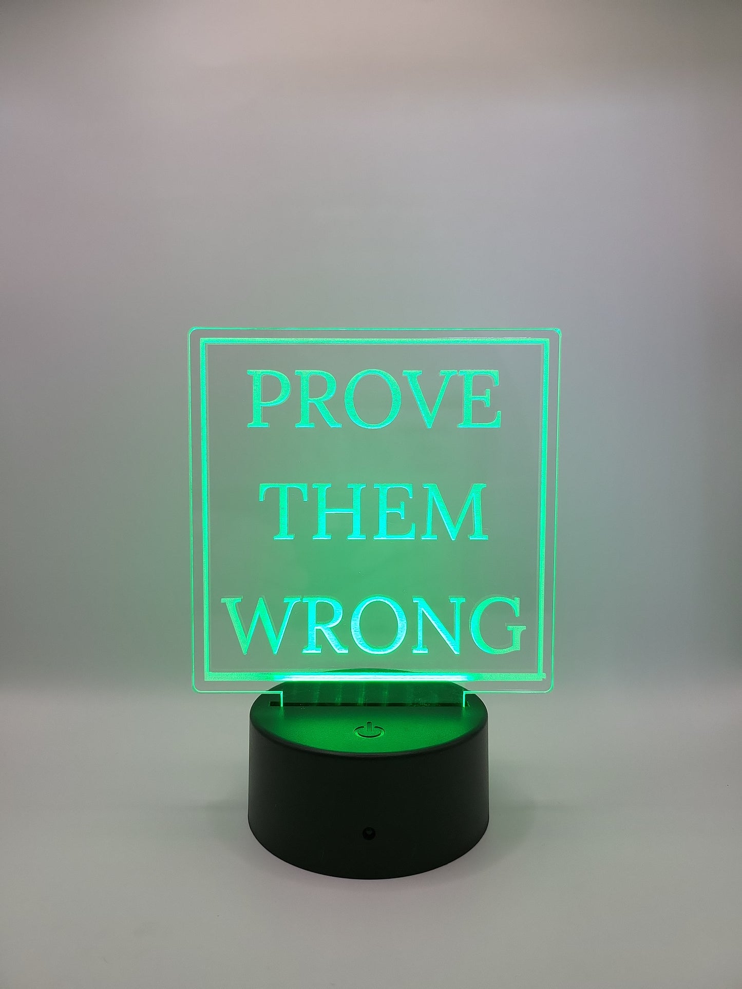 Motivational acrylic sign, with color-changing light base.